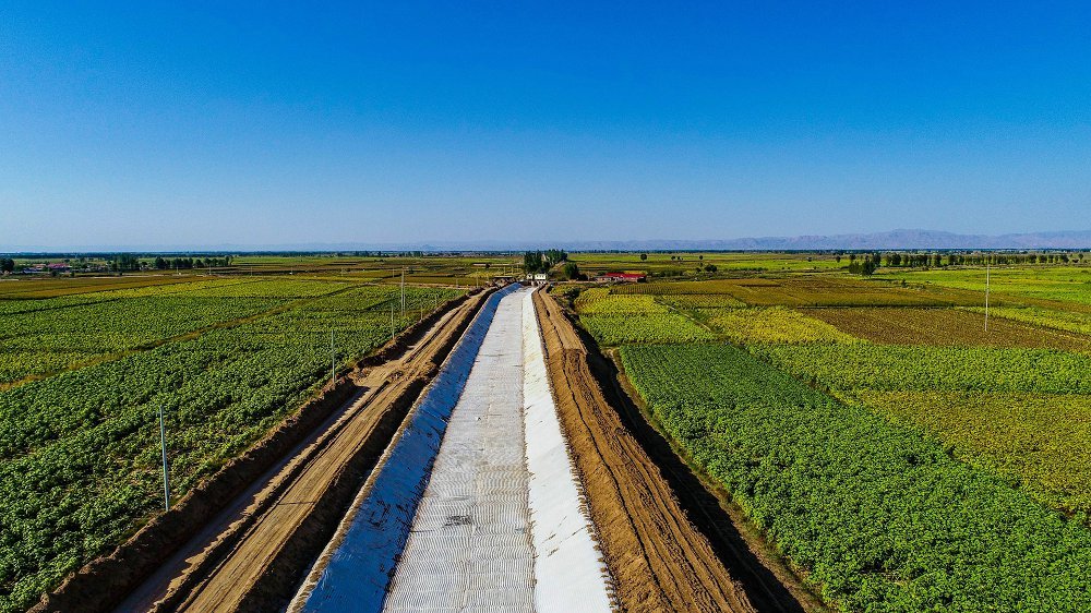 long irrigation canal with concrete mattress lining aerial view